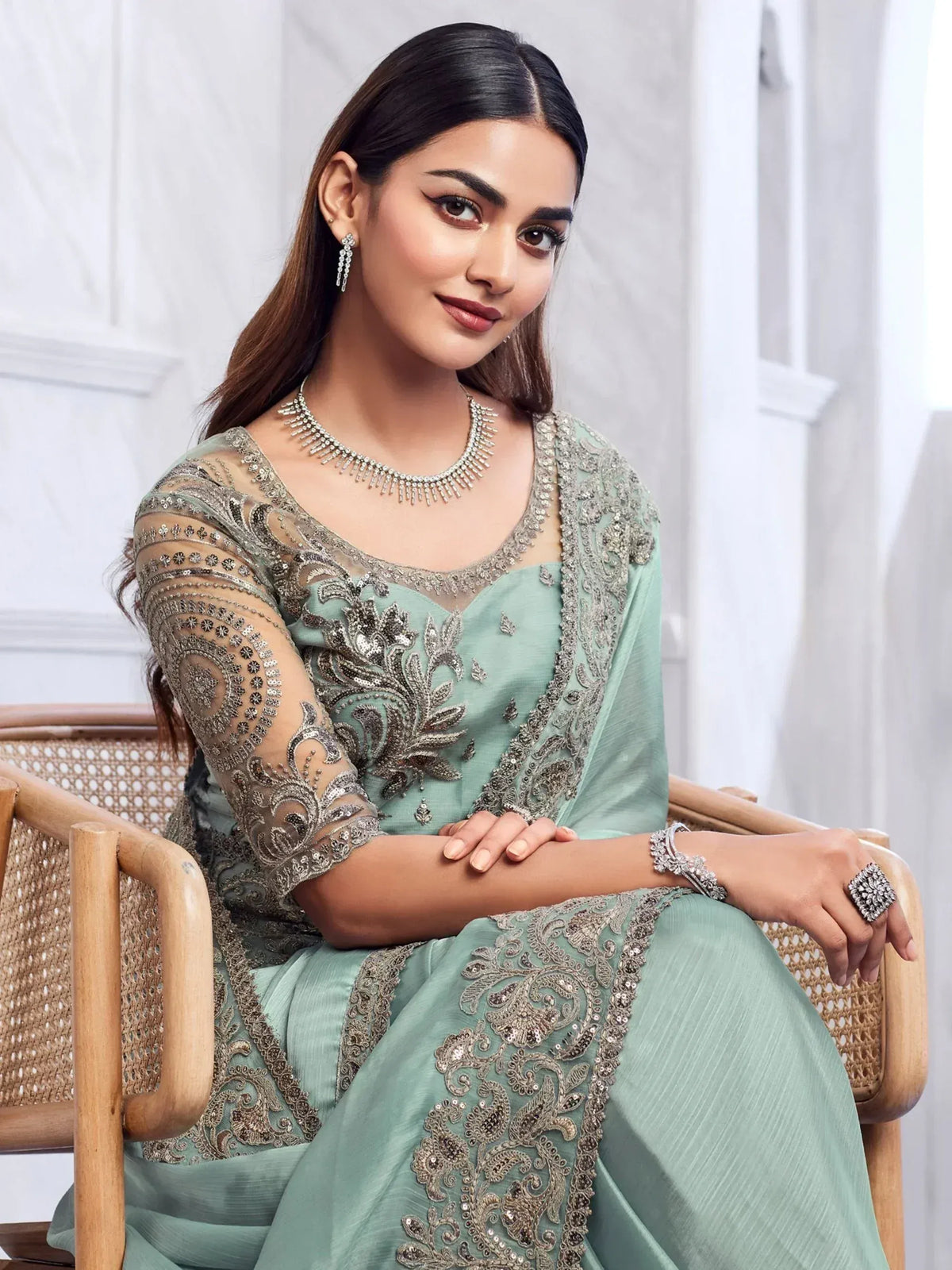 Elegant mint green designer salwar kameez with heavy silver embroidery and matching jewelry