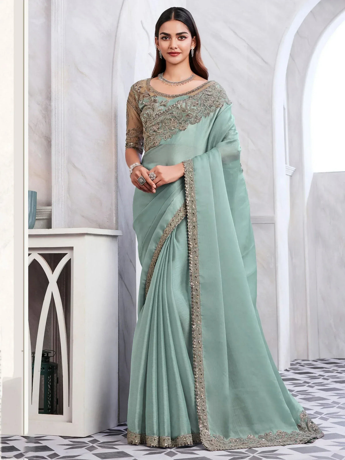 Mint green designer saree with silver embroidery, perfect for Indian ethnic wear occasions