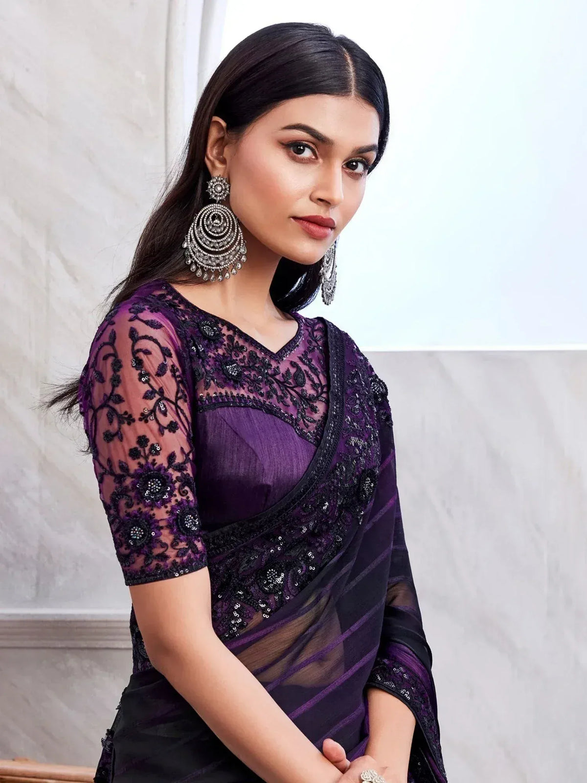 Purple and black embroidered saree with sheer lace blouse, perfect for Indian ethnic occasions