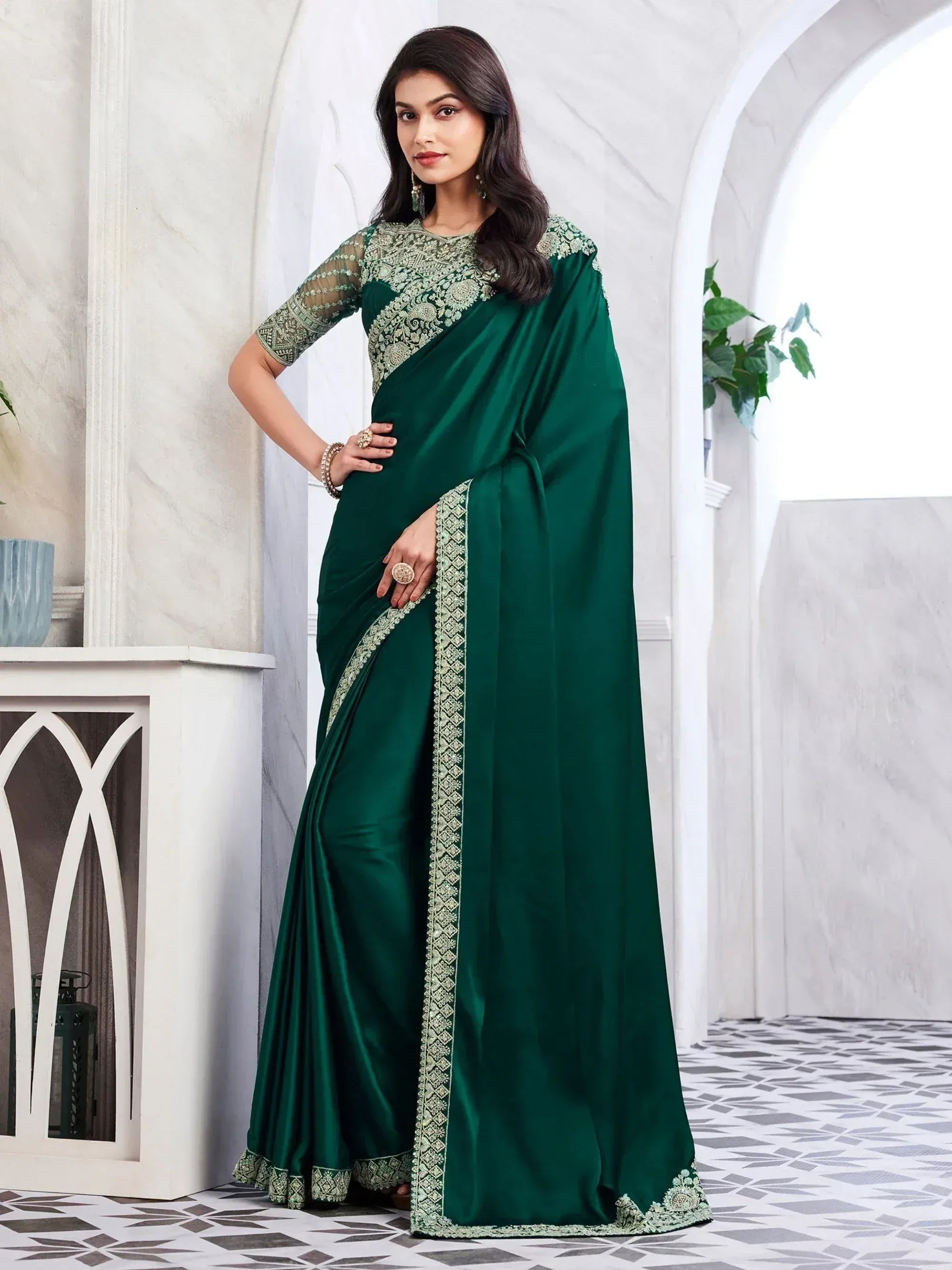 Emerald green designer saree with gold embroidery, perfect for Indian ethnic wear occasions