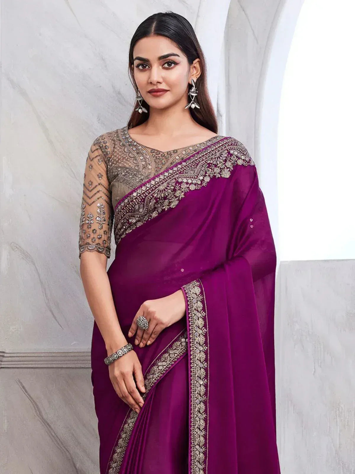 Elegant purple saree with silver embroidery and sheer blouse, perfect for Indian ethnic occasions
