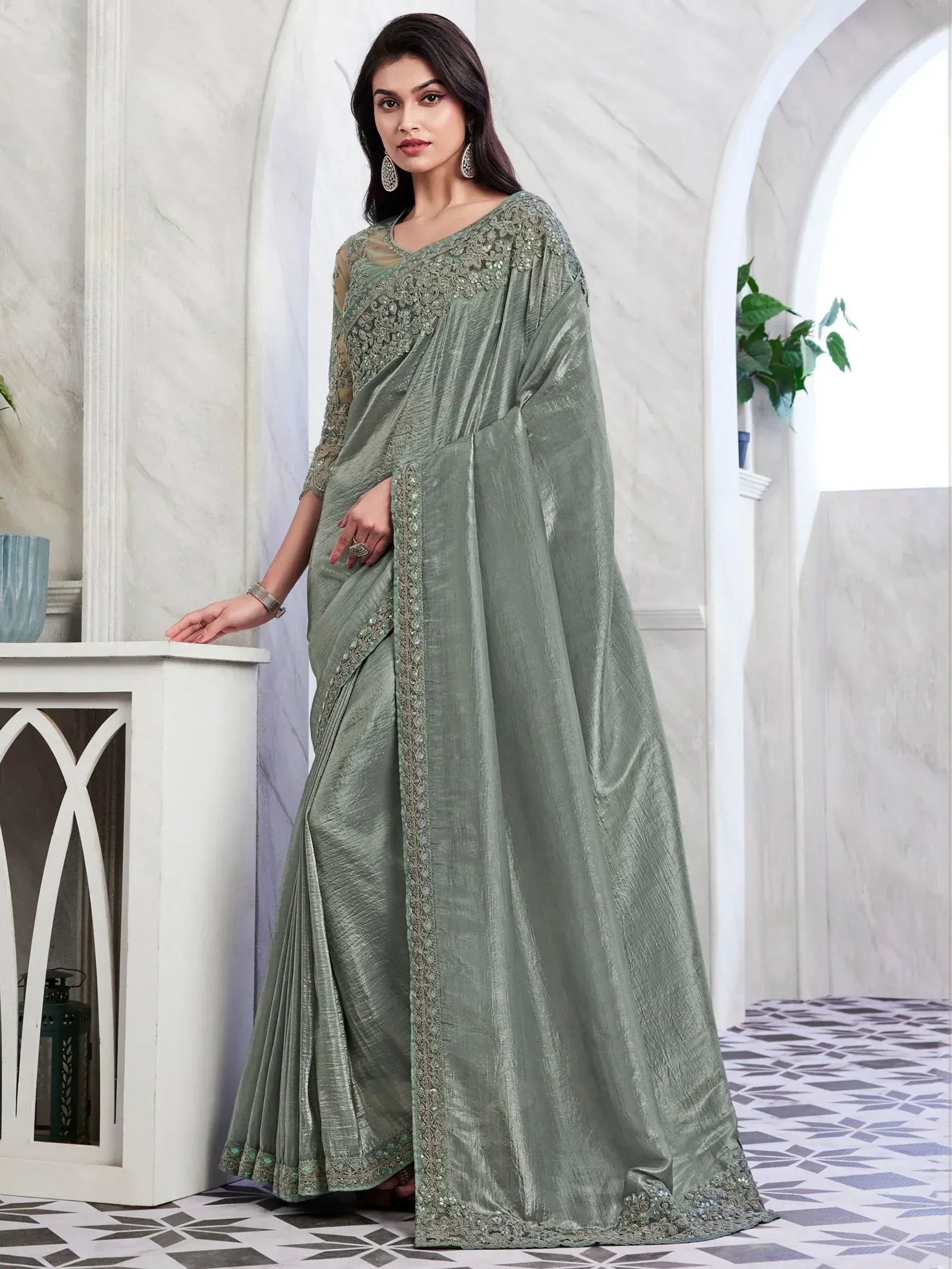 Elegant sage green saree with intricate embroidery, perfect for Indian ethnic wear occasions