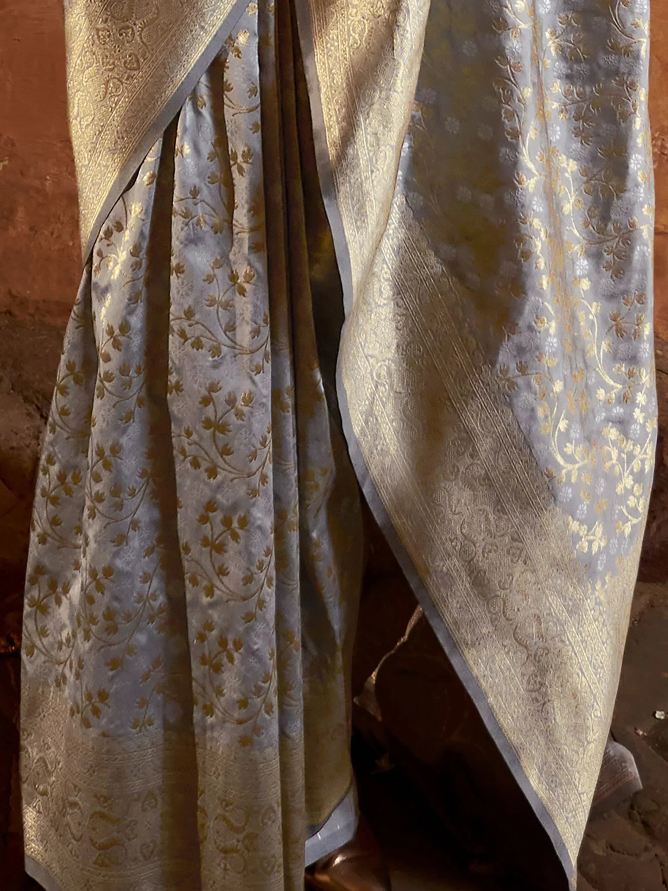 Grey and gold floral Banarasi saree with intricate zari work, perfect for Indian ethnic wear