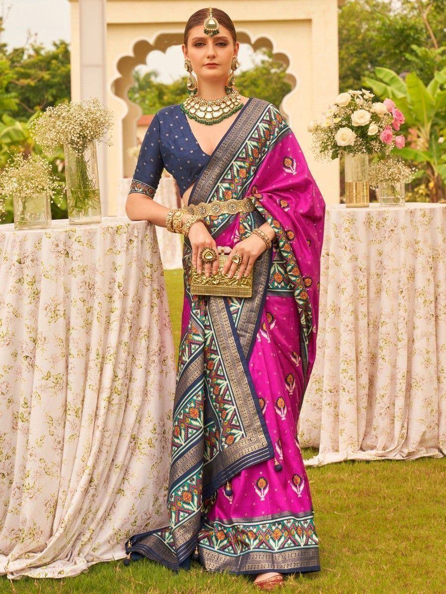Vibrant pink and blue designer saree with intricate embroidery, perfect for Indian ethnic occasions