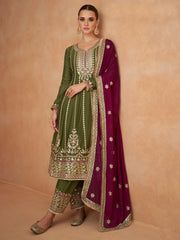 Woman in green embroidered salwar kameez with maroon dupatta, ethnic Indian wear