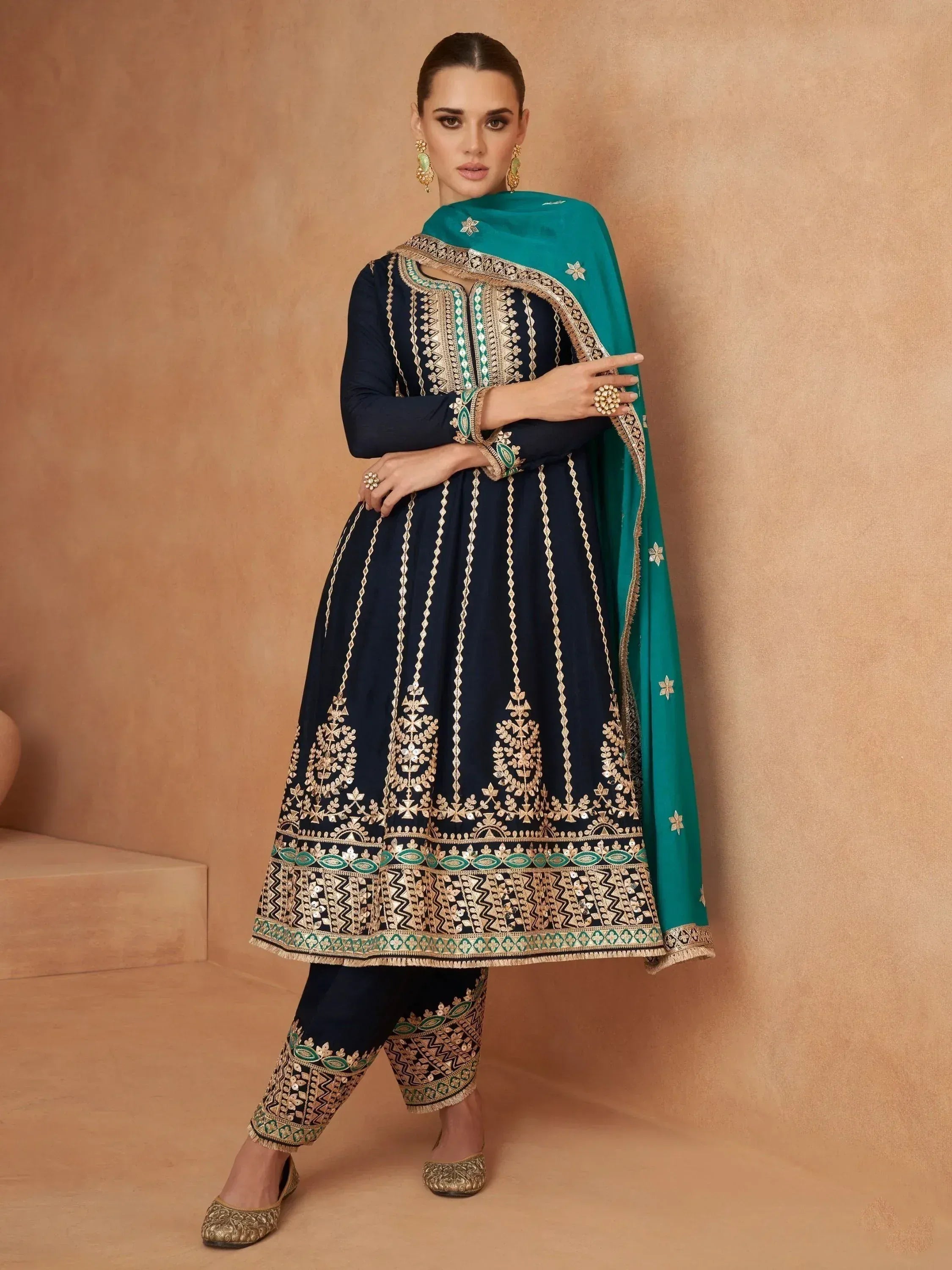 Elegant navy blue anarkali with gold embroidery and teal dupatta, perfect for Indian ethnic wear.