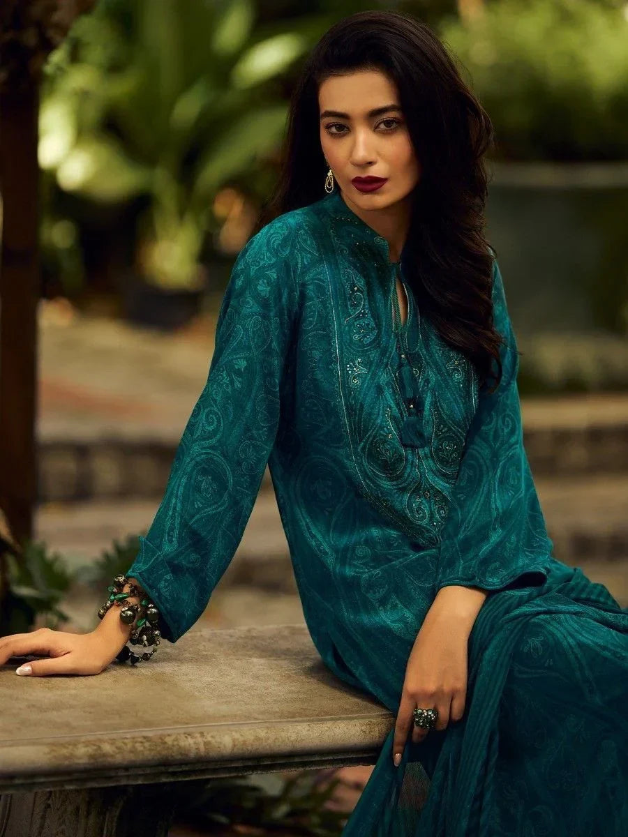 Woman in teal embroidered salwar kameez posing outdoors, Indian ethnic wear fashion