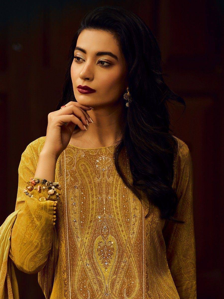 Elegant yellow embroidered salwar kameez with intricate paisley design and embellished sleeves