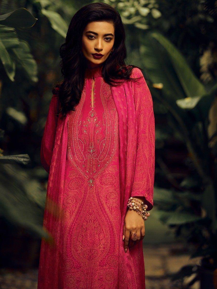 Pink embroidered ethnic gown with gold detailing, styled for Indian festive wear