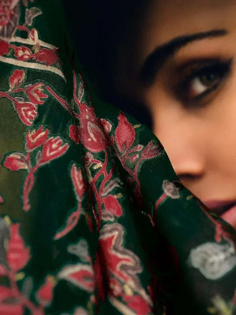 Elegant green floral saree with red and gold embroidery, showcasing traditional Indian ethnic wear.