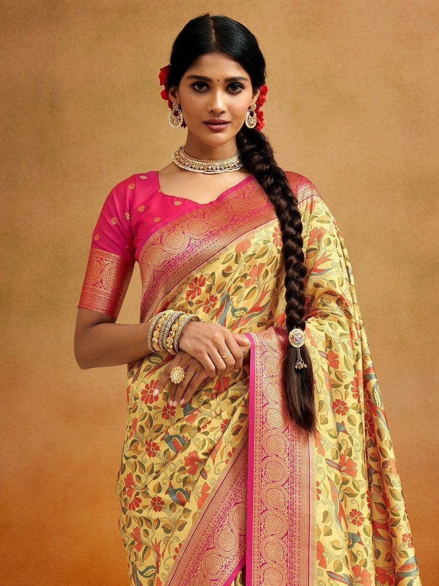 Yellow floral saree with pink border and blouse, styled with traditional jewelry for Indian ethnic wear