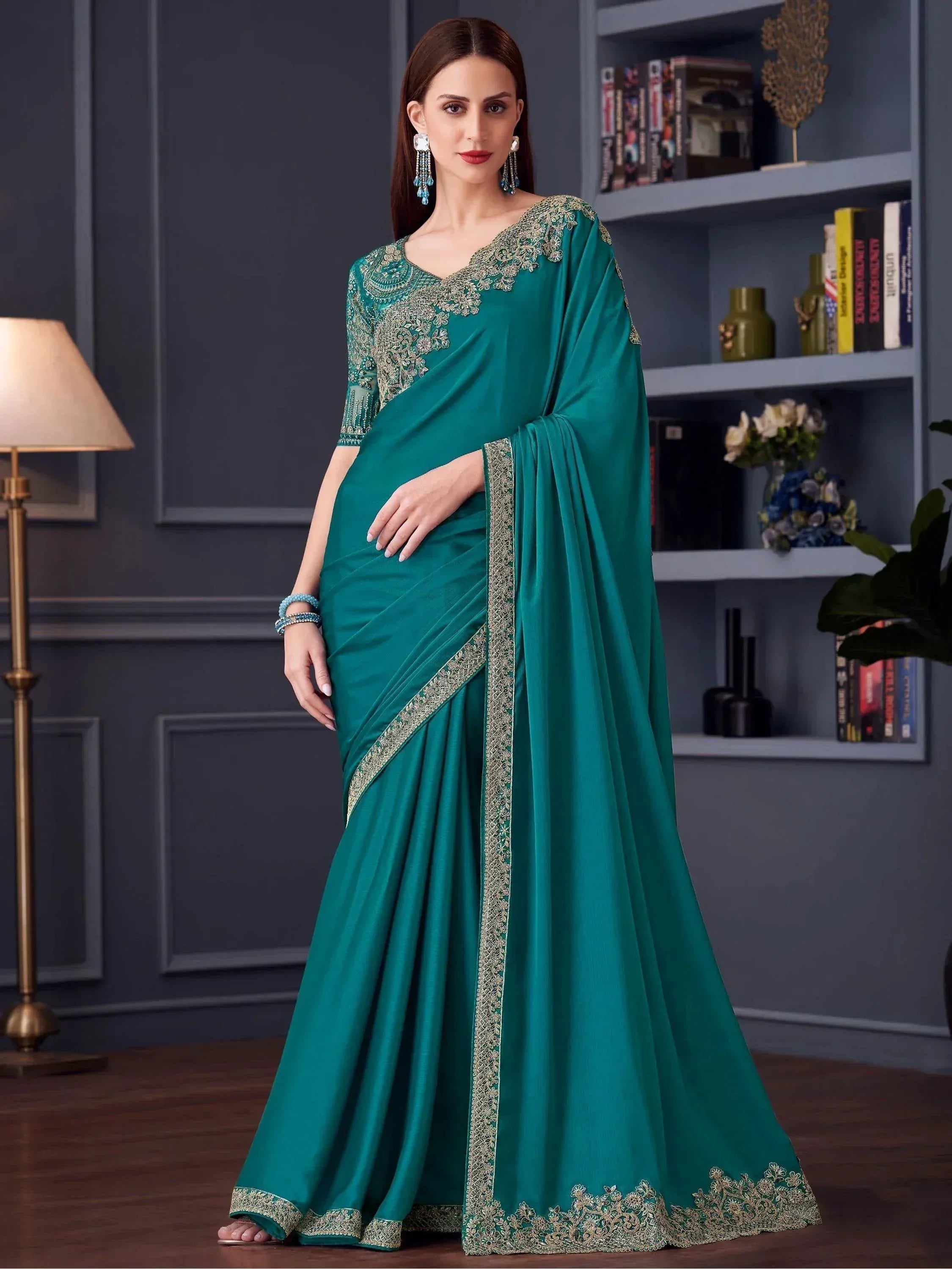 Emerald green designer saree with gold embroidery, perfect for Indian ethnic wear occasions