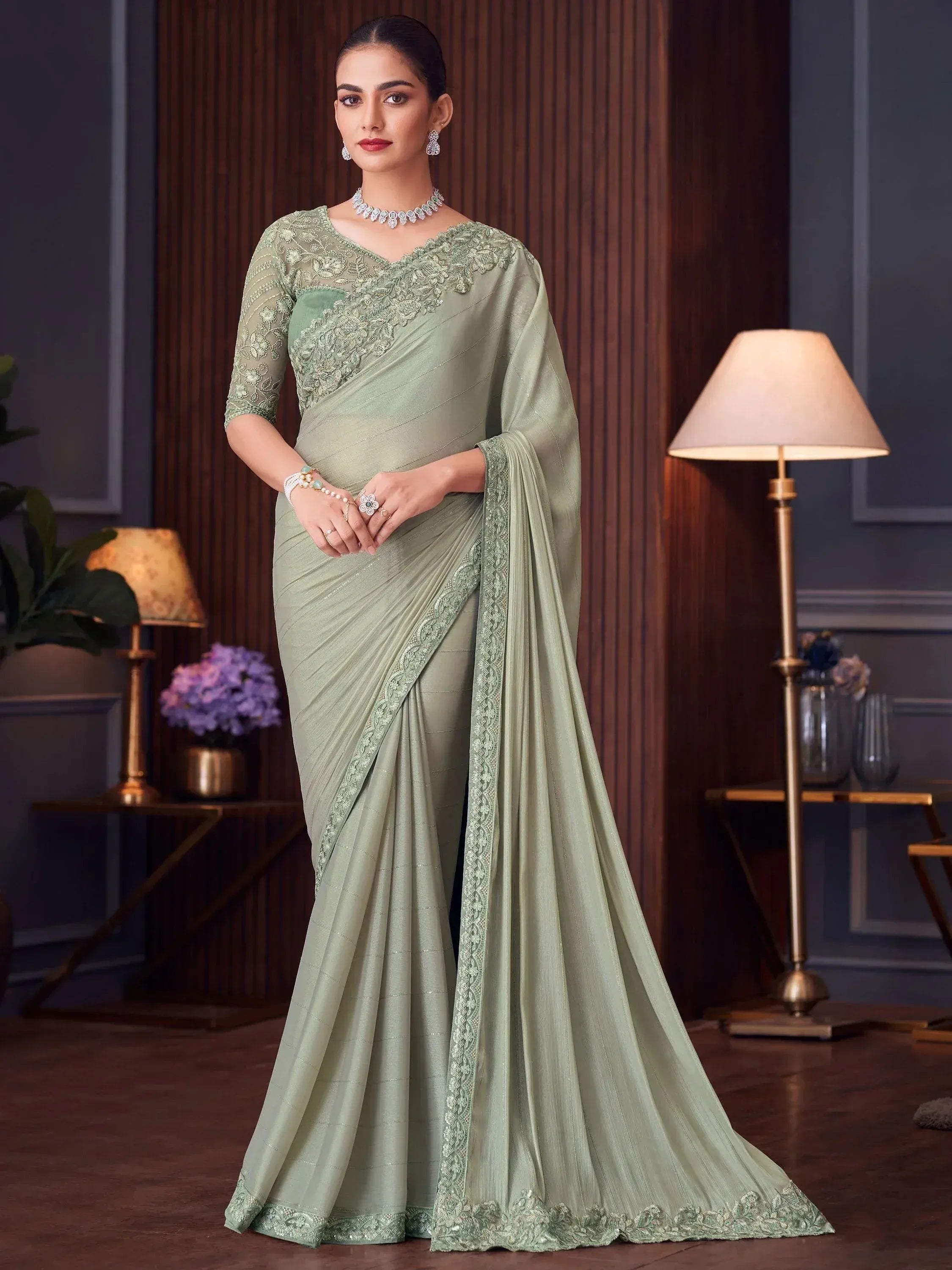 Elegant sage green saree with lace blouse, perfect for Indian ethnic occasions and festive wear.