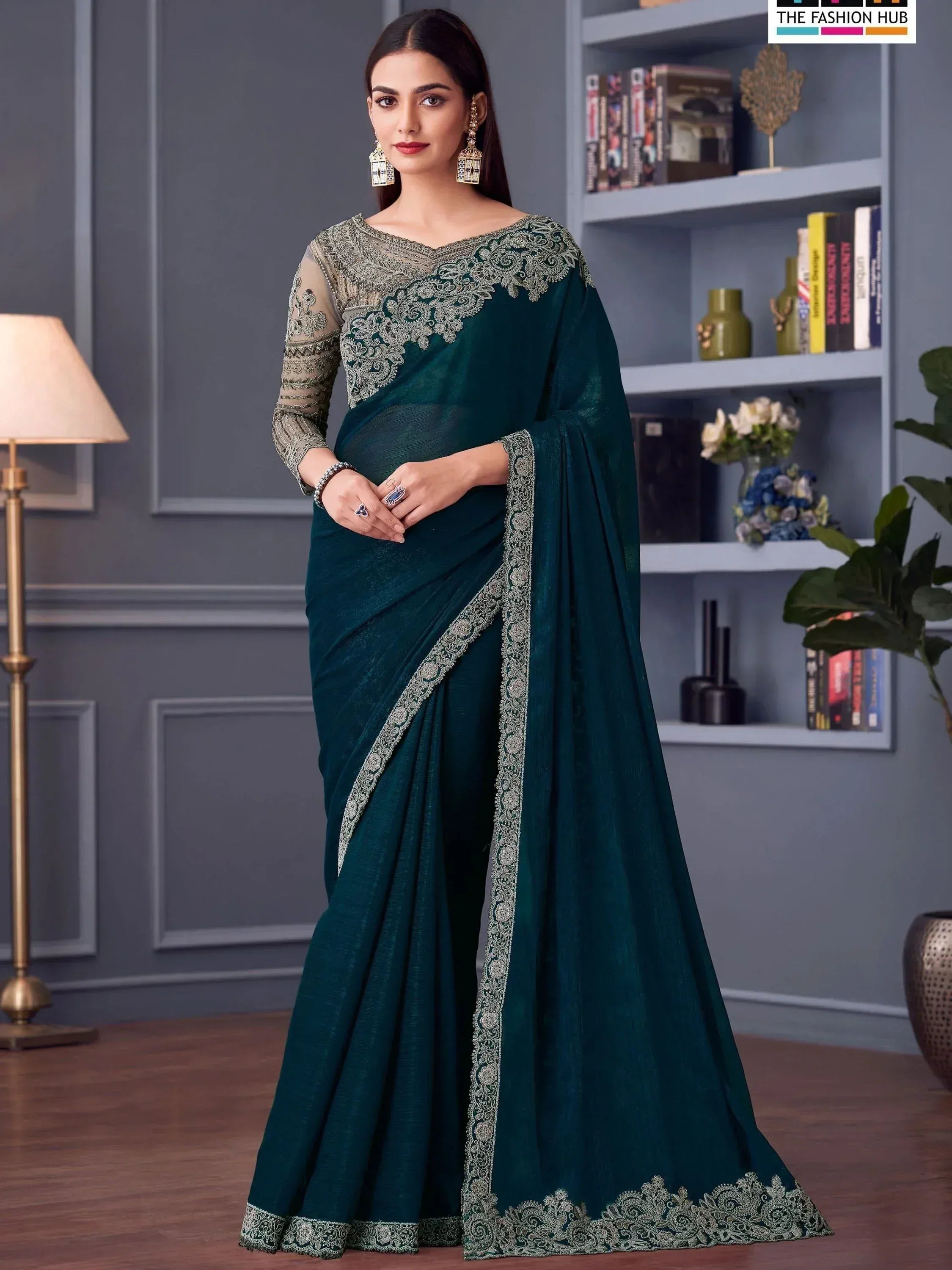 Emerald green saree with silver lace embroidery, perfect for Indian ethnic occasions and festive events.