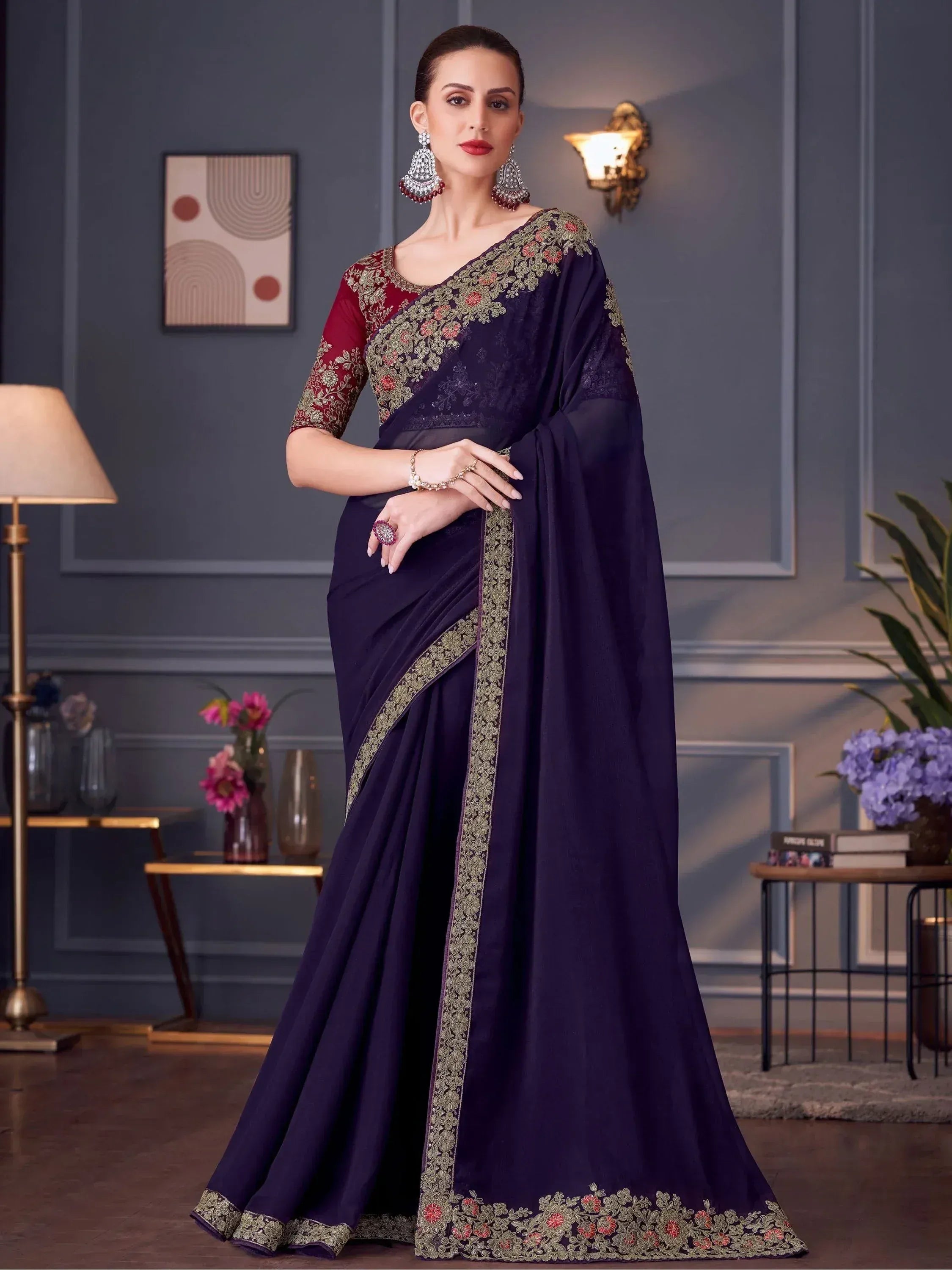 Elegant purple saree with gold floral embroidery and maroon blouse, perfect for Indian ethnic occasions.