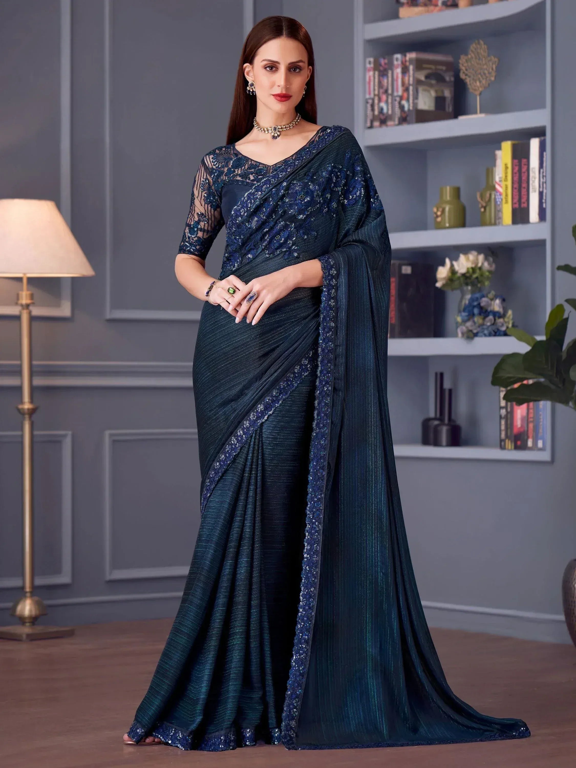 Elegant navy blue designer saree with sequin embroidery and sheer blouse, perfect for Indian ethnic occasions.