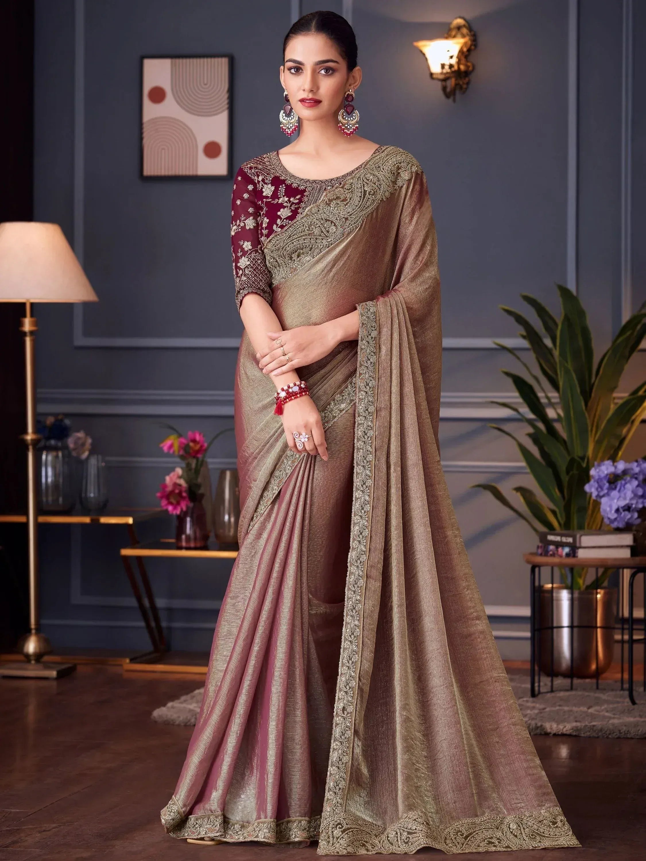 Elegant maroon and gold embroidered saree with designer blouse, perfect for Indian ethnic occasions