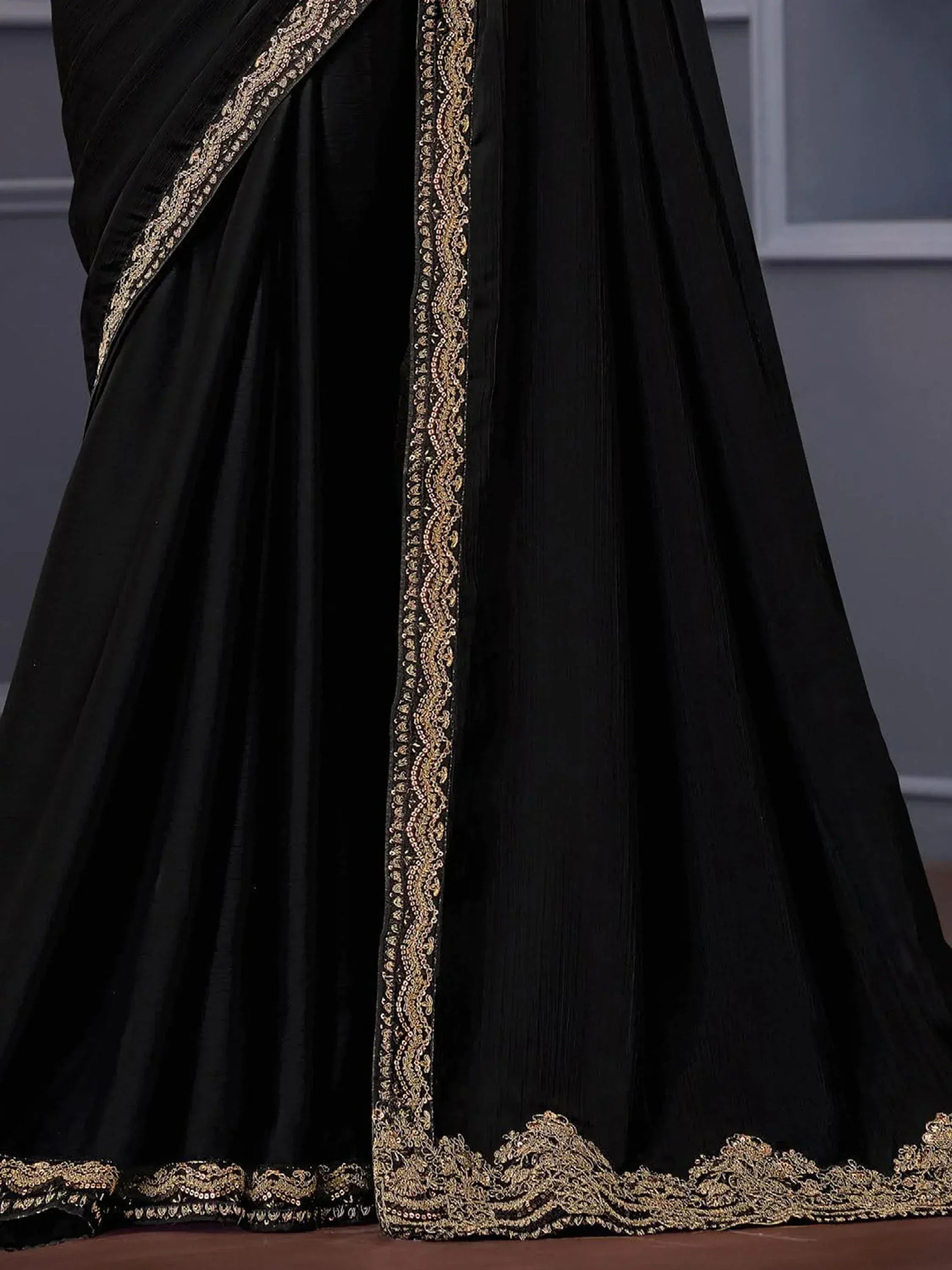 Black ethnic saree with gold embroidery and sequin border, designer Indian wear