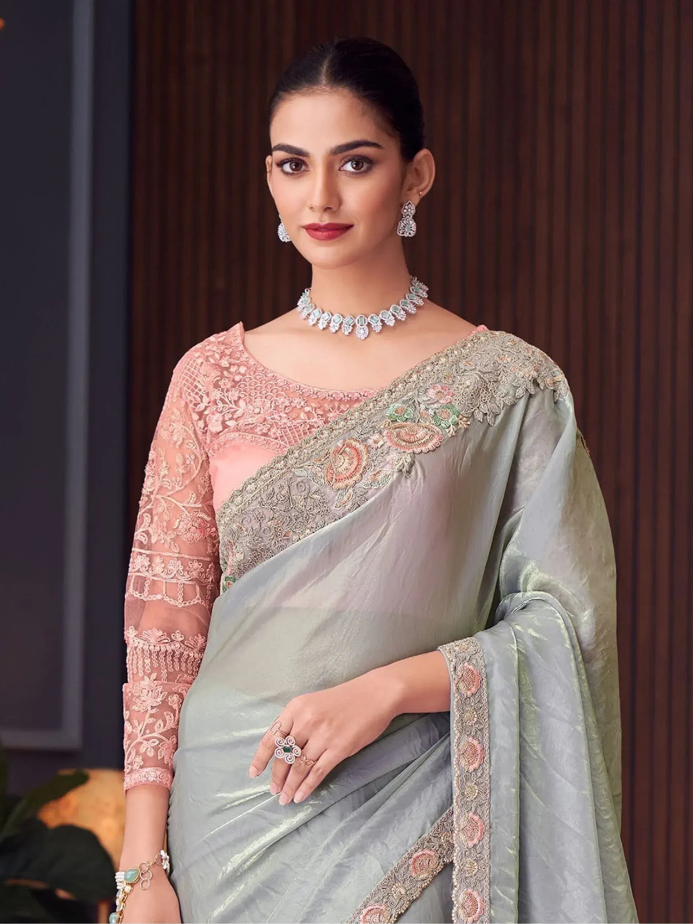 Elegant Indian saree with pink lace blouse and floral embroidery, perfect for weddings and parties