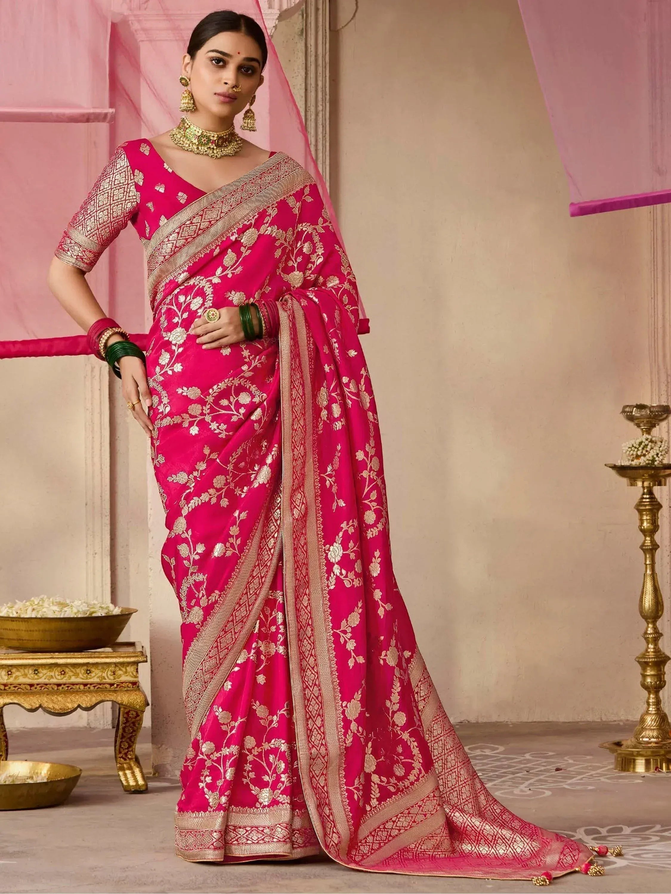 Pink floral embroidered saree with gold border, traditional Indian ethnic wear for women