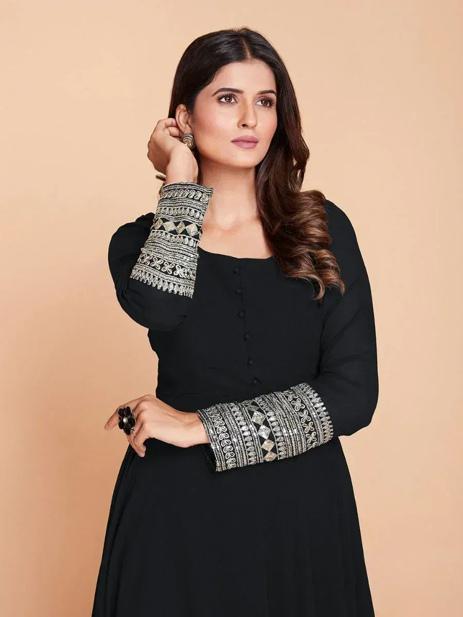 Black ethnic gown with silver embroidered sleeves, perfect for Indian occasions and festive wear.