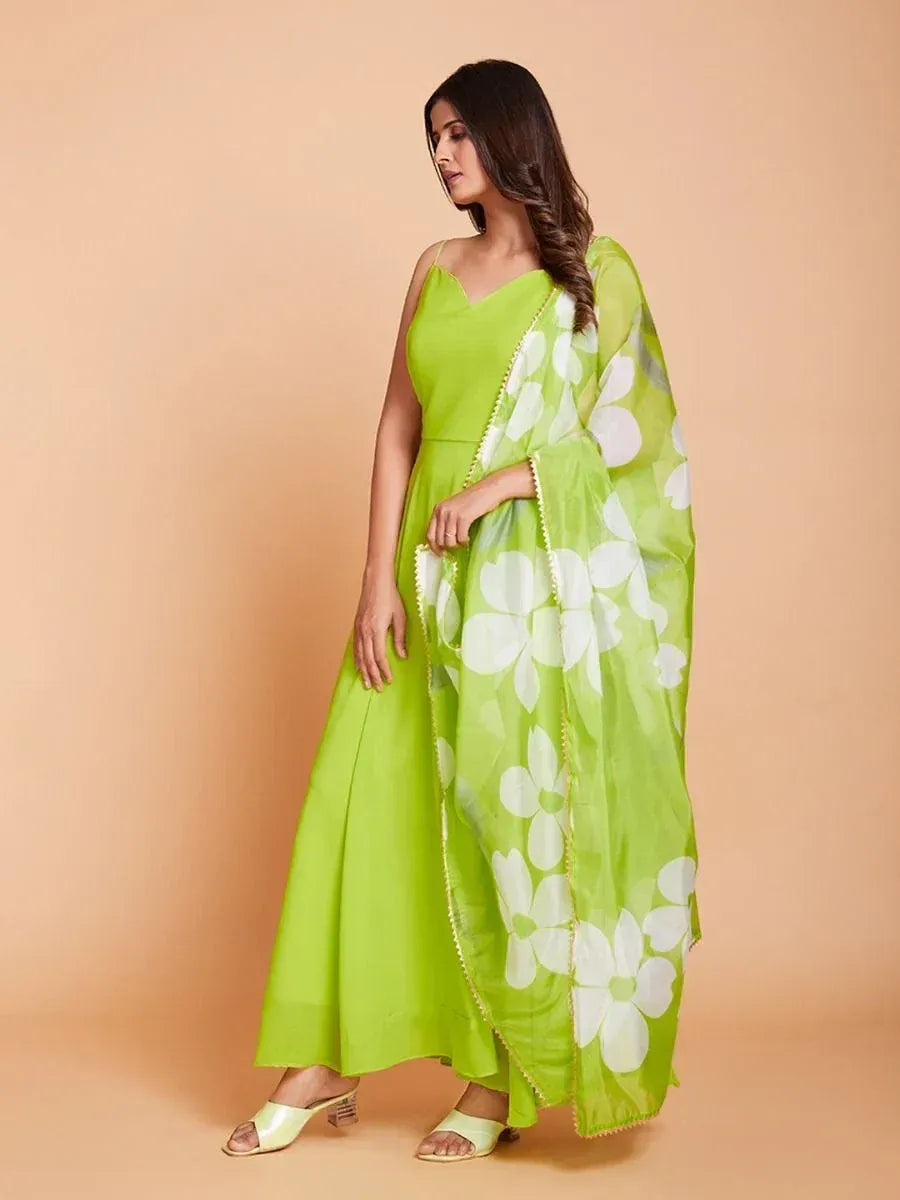 Woman in a lime green ethnic gown with floral print dupatta, stylish Indian attire