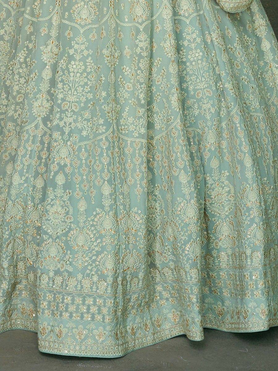 Mint green lehenga with intricate gold floral embroidery, perfect for Indian ethnic wear occasions.