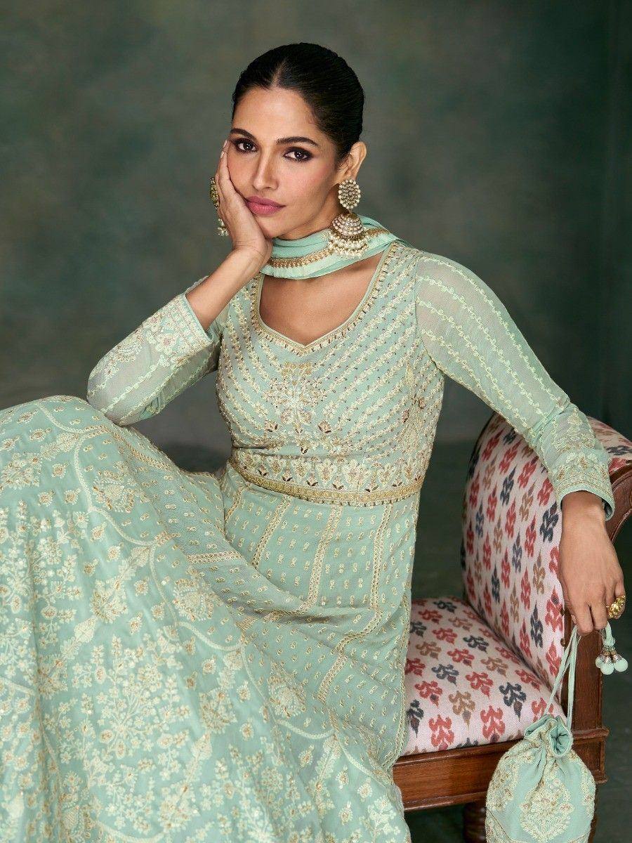 Mint green embroidered salwar kameez with gold detailing, perfect for ethnic occasions