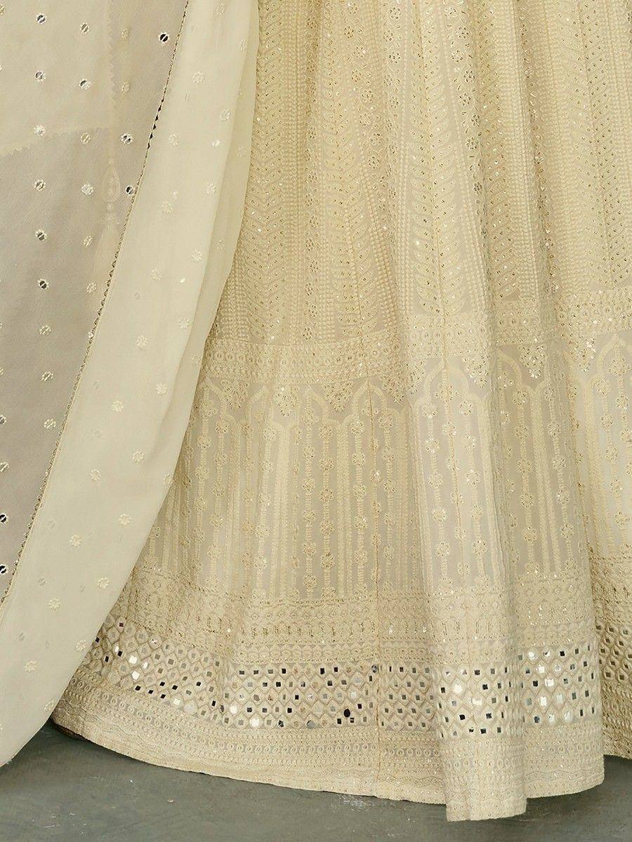 Cream ethnic lehenga with mirror work and sheer dupatta, designer Indian wear