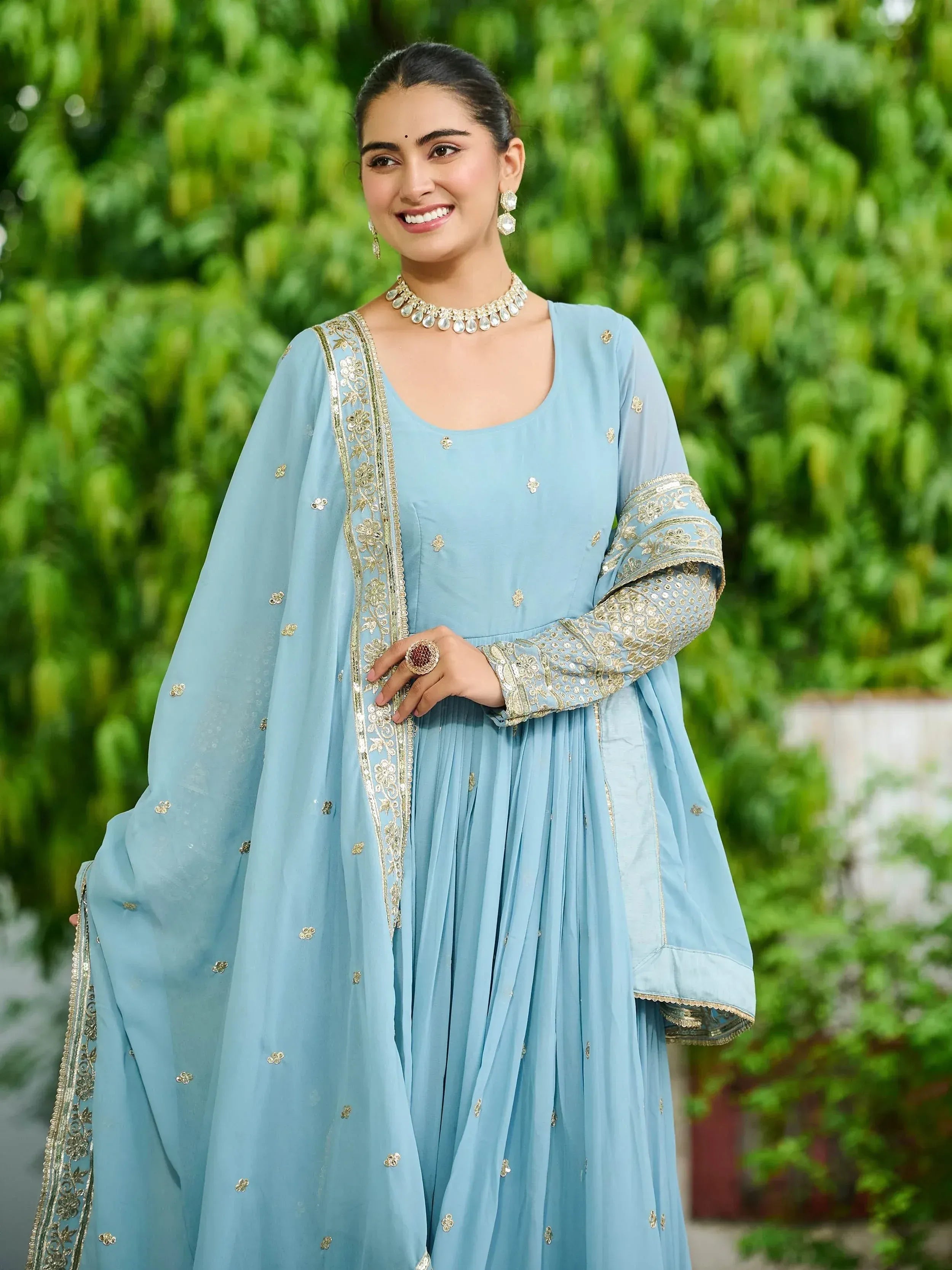 Elegant light blue salwar kameez with gold embroidery and matching dupatta, perfect for ethnic occasions.