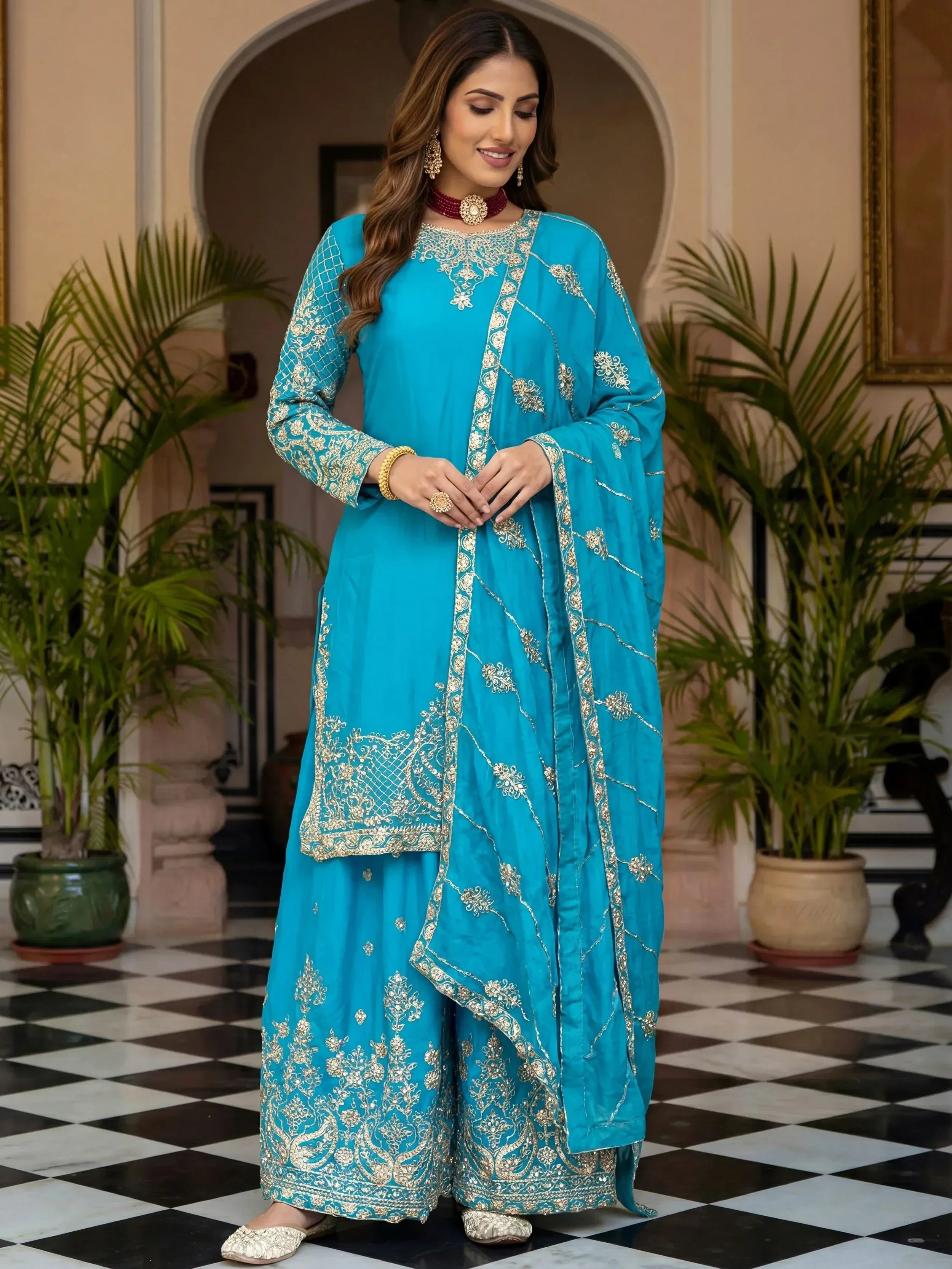 Turquoise embroidered salwar kameez with gold work, perfect for Indian ethnic wear occasions