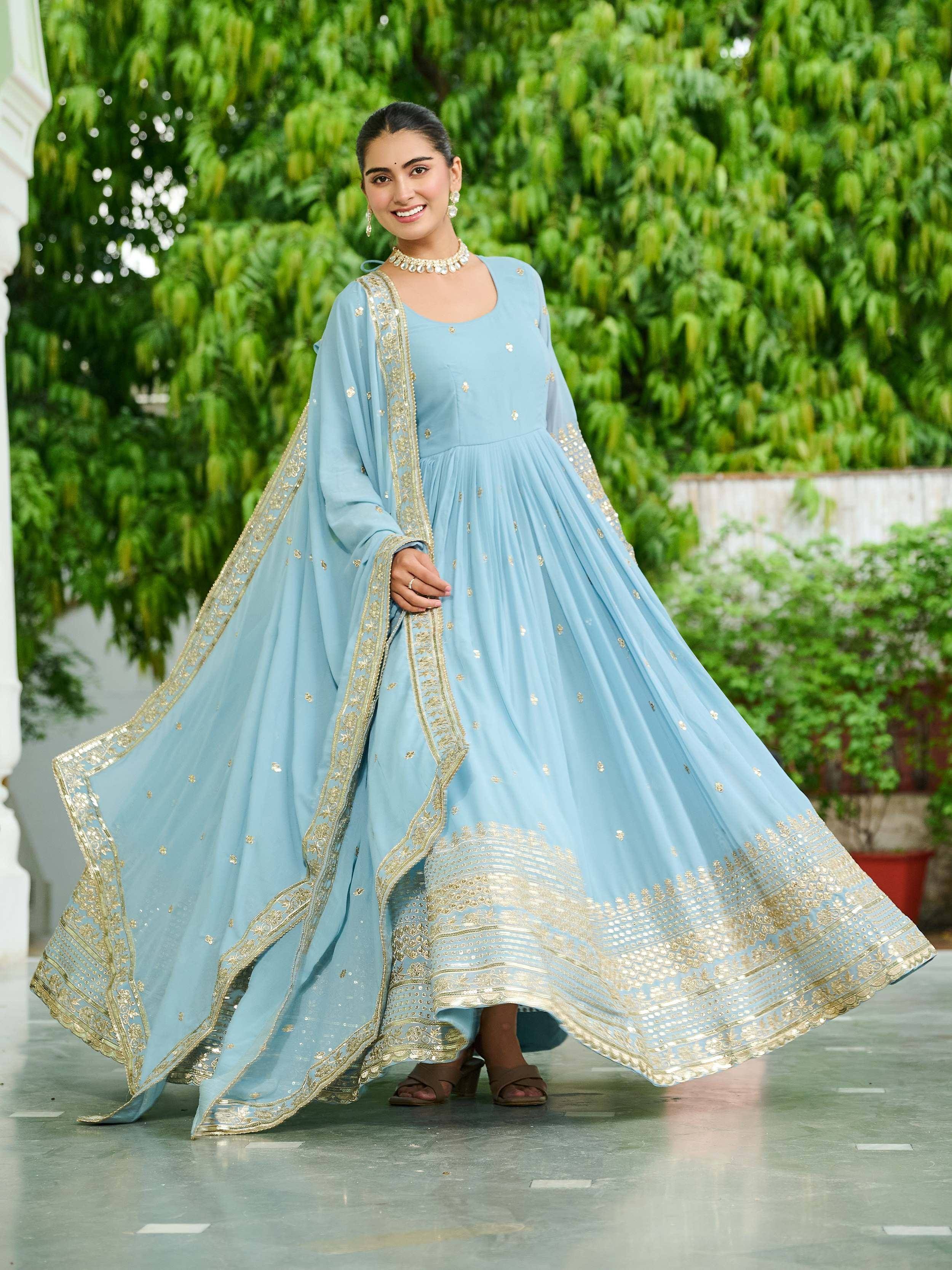 Light blue ethnic gown with gold embroidery, perfect for Indian festive occasions