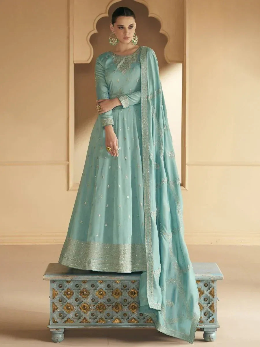 Mint green designer anarkali suit with gold embroidery, perfect for Indian ethnic wear occasions