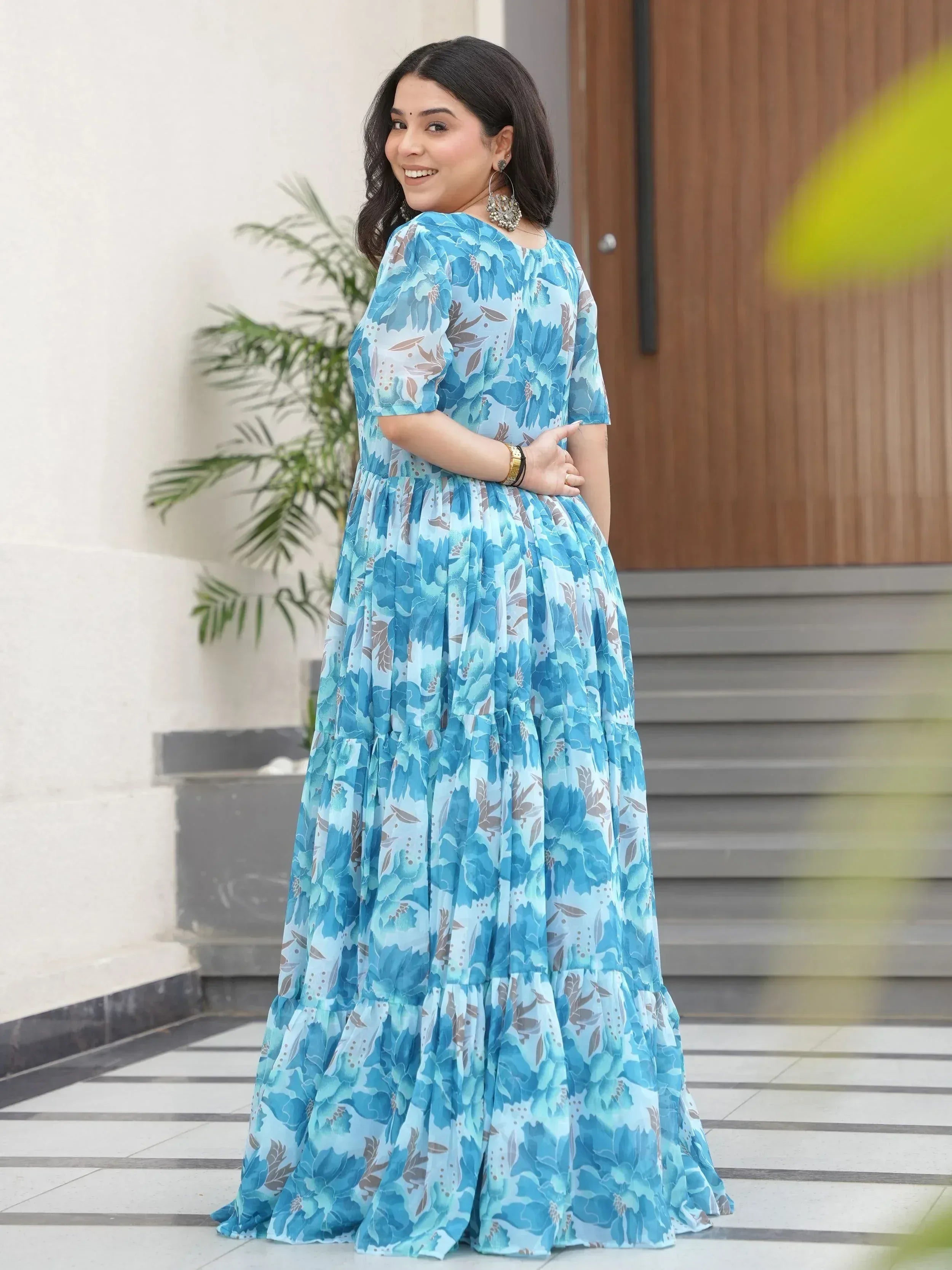 Blue floral ethnic gown with tiered skirt, perfect for Indian occasions and festive wear