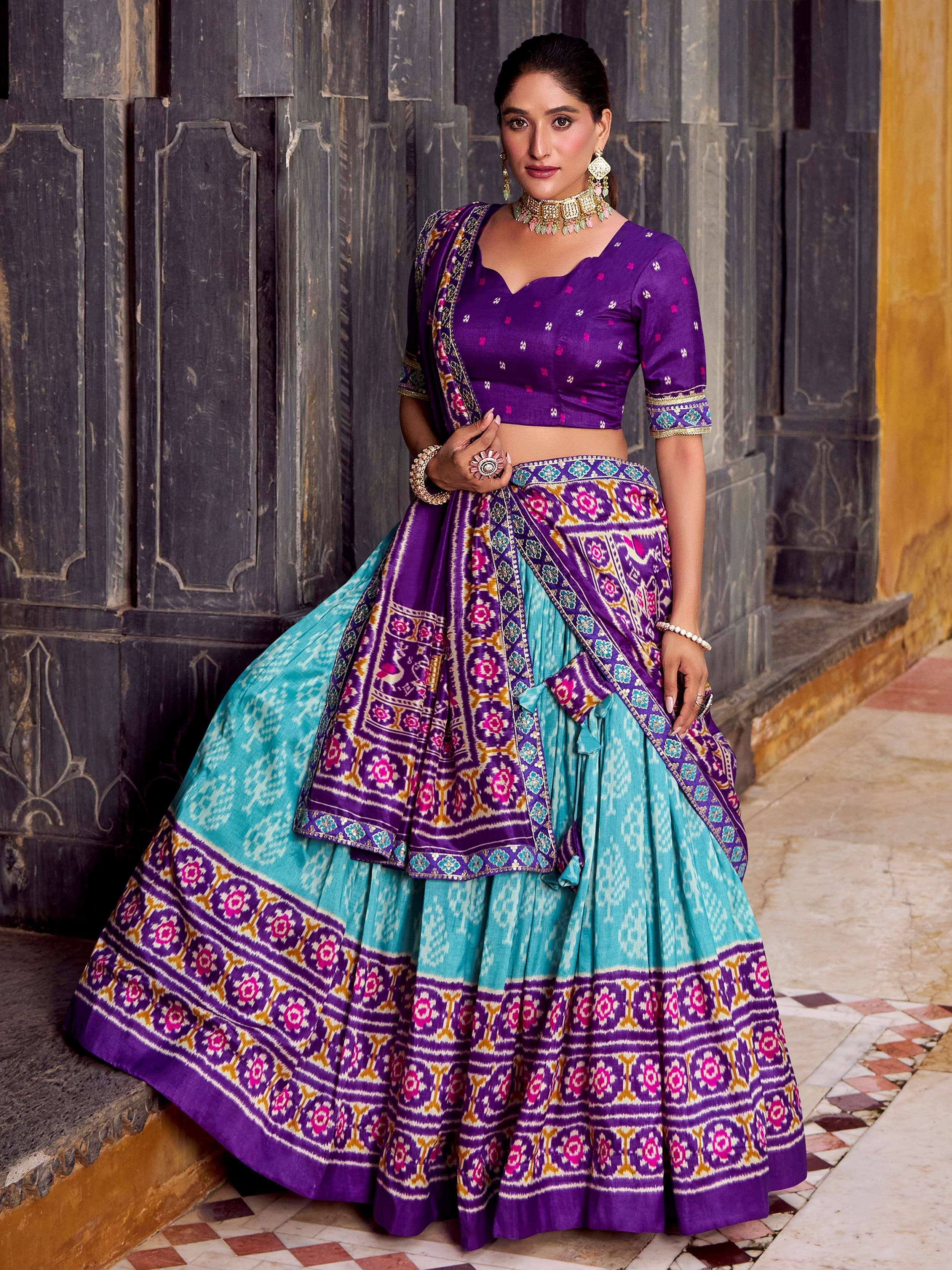 Purple and turquoise designer lehenga choli with intricate ikat print, perfect for Indian ethnic wear occasions