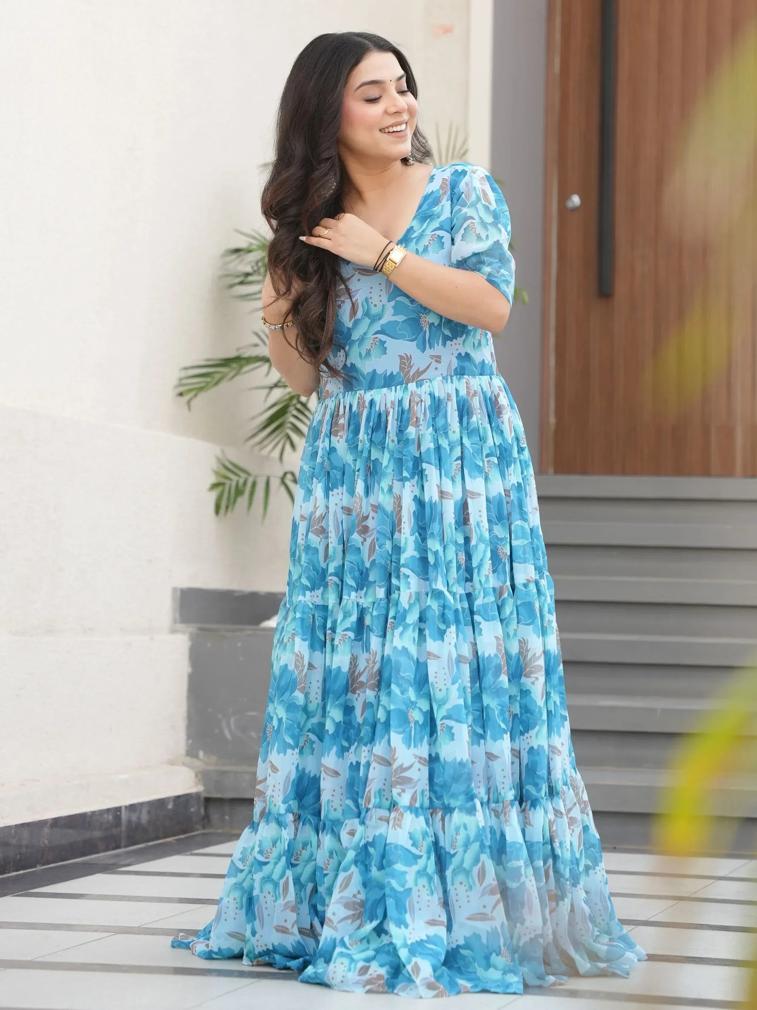 Blue floral ethnic gown with puff sleeves, perfect for Indian occasions and festive wear.