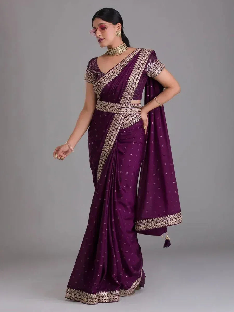 Elegant purple ethnic saree with gold embroidery, perfect for Indian occasions and festive wear.
