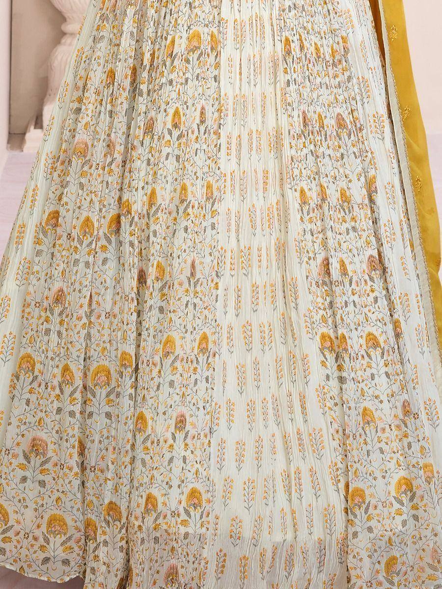 Floral printed ethnic lehenga skirt with pleats and mustard border, ideal for Indian weddings and festive occasions.