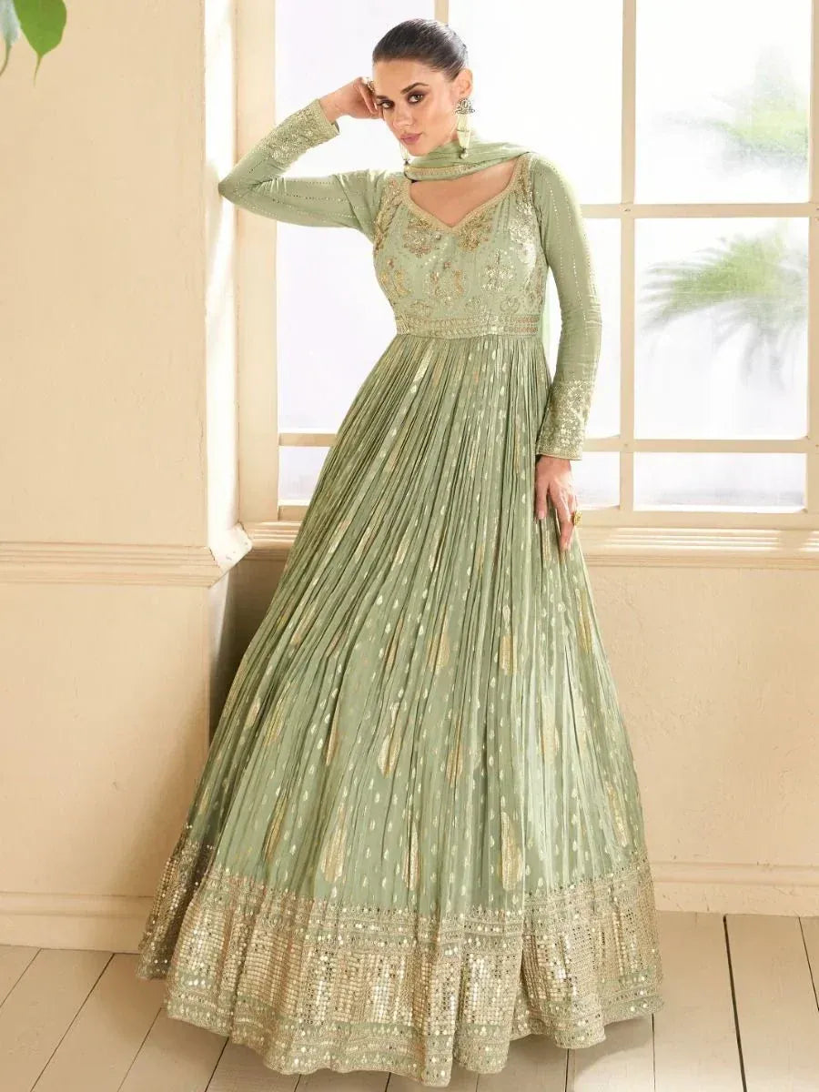 Mint green embroidered anarkali gown with gold detailing, perfect for Indian ethnic wear occasions.