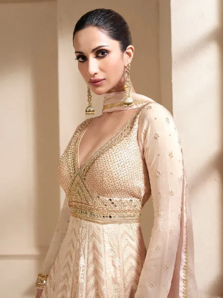 Elegant beige designer anarkali with gold embroidery, perfect for Indian ethnic wear occasions