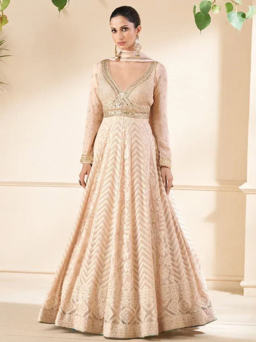Elegant beige embroidered anarkali gown with V-neck and full sleeves, perfect for Indian ethnic occasions.