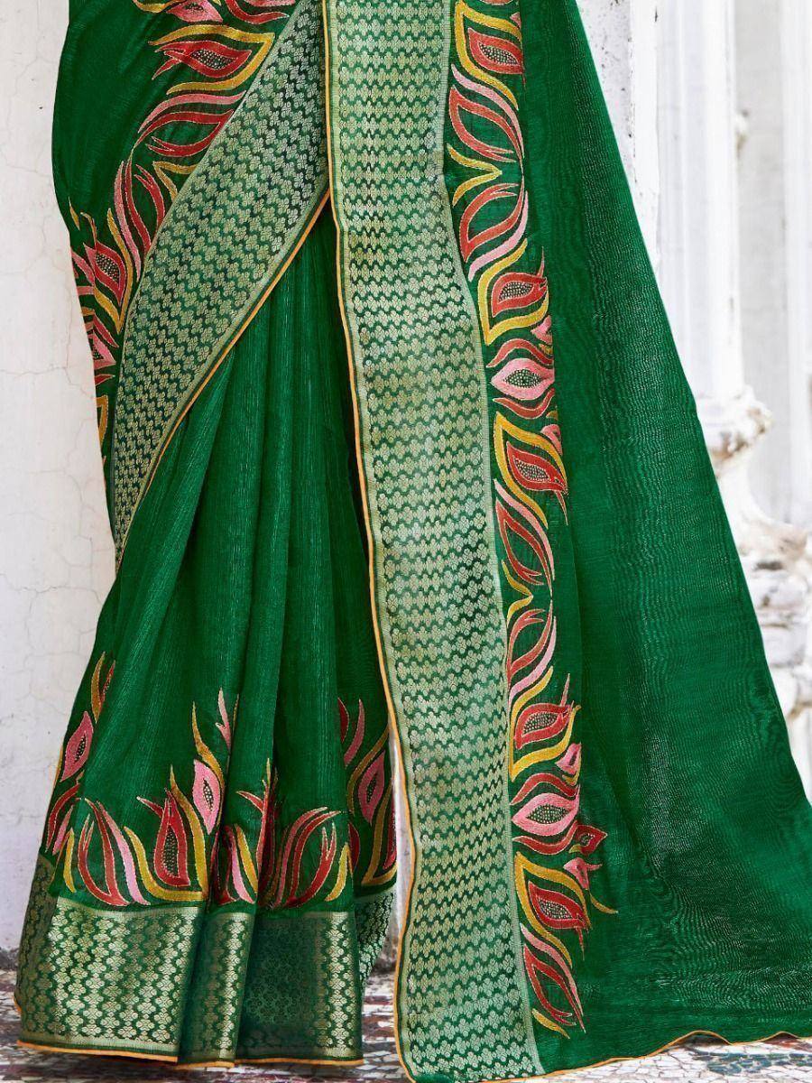 Green saree with floral embroidery and geometric border, perfect for ethnic wear occasions.