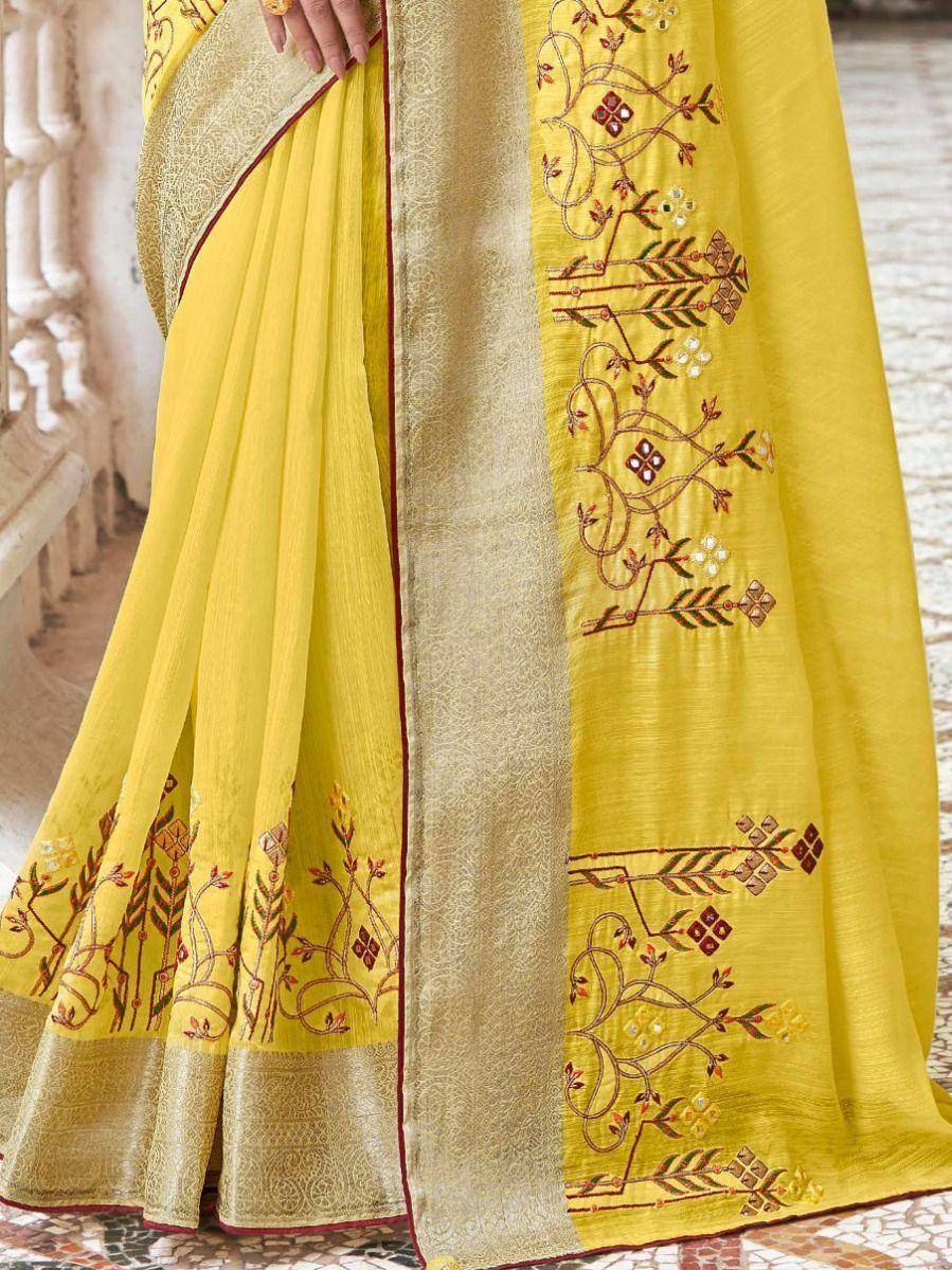 Yellow embroidered saree with gold border and floral motifs, ethnic wear for women