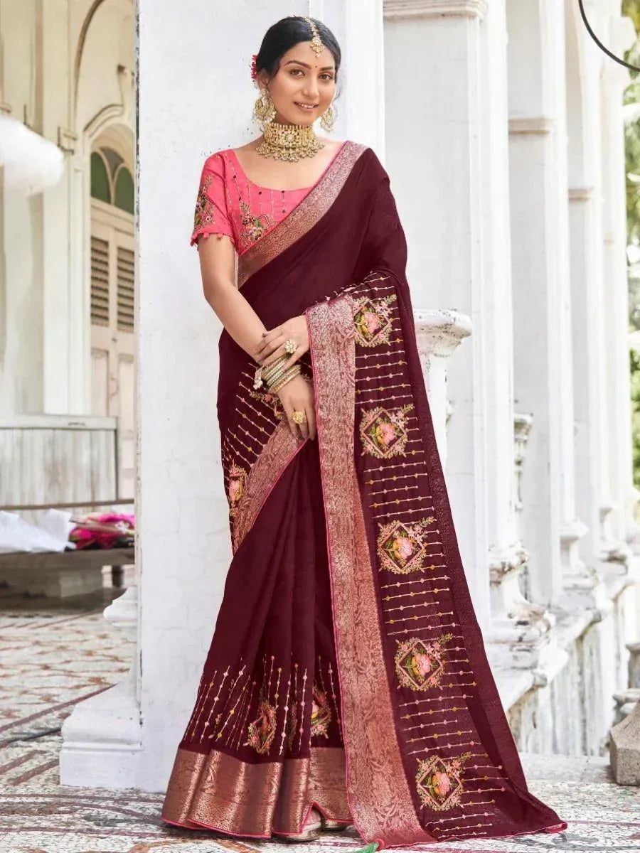 Maroon embroidered saree with pink blouse, gold jewelry, traditional Indian ethnic wear for weddings
