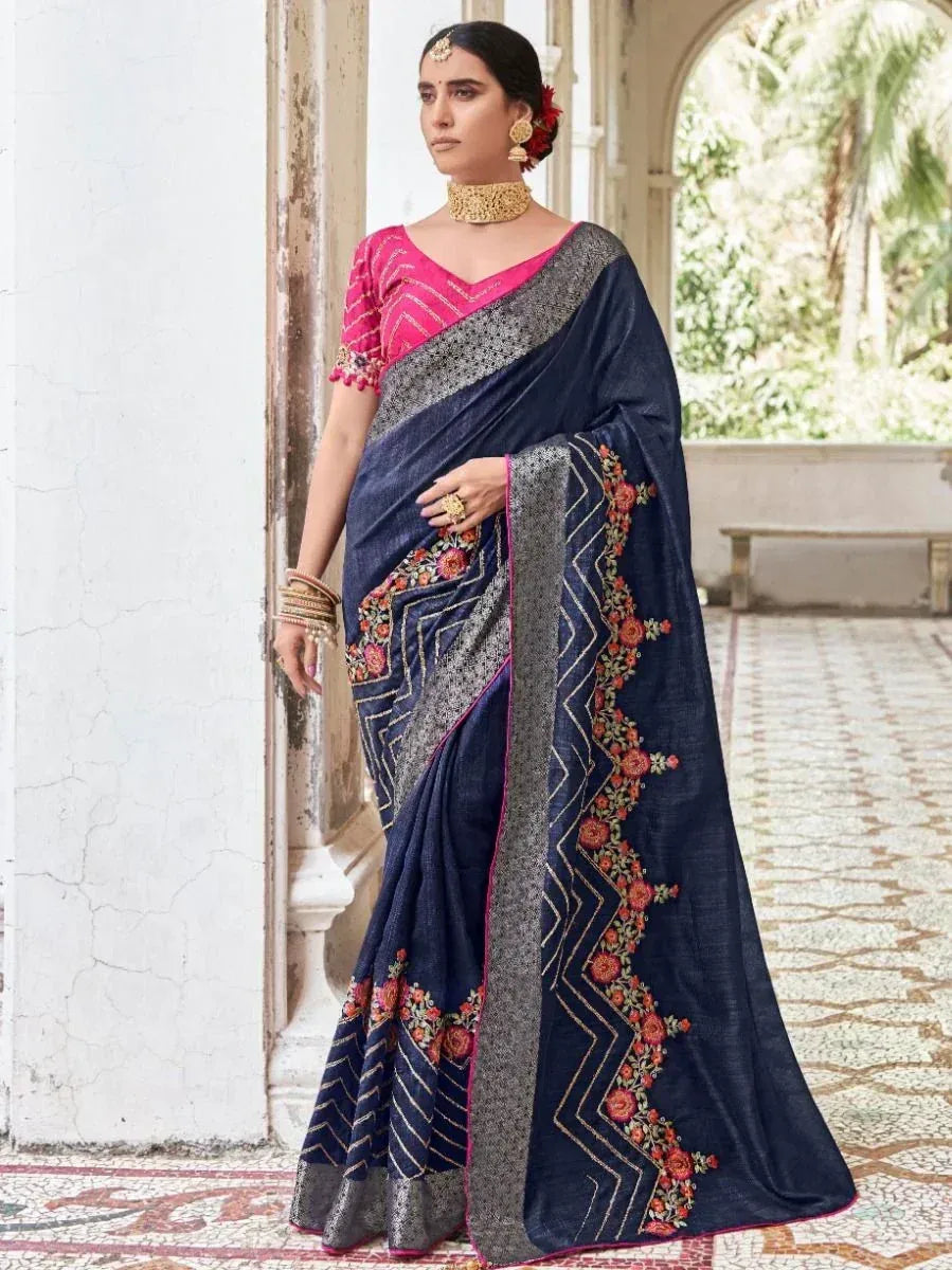 Navy blue saree with floral embroidery and pink blouse, styled for Indian ethnic wear occasions