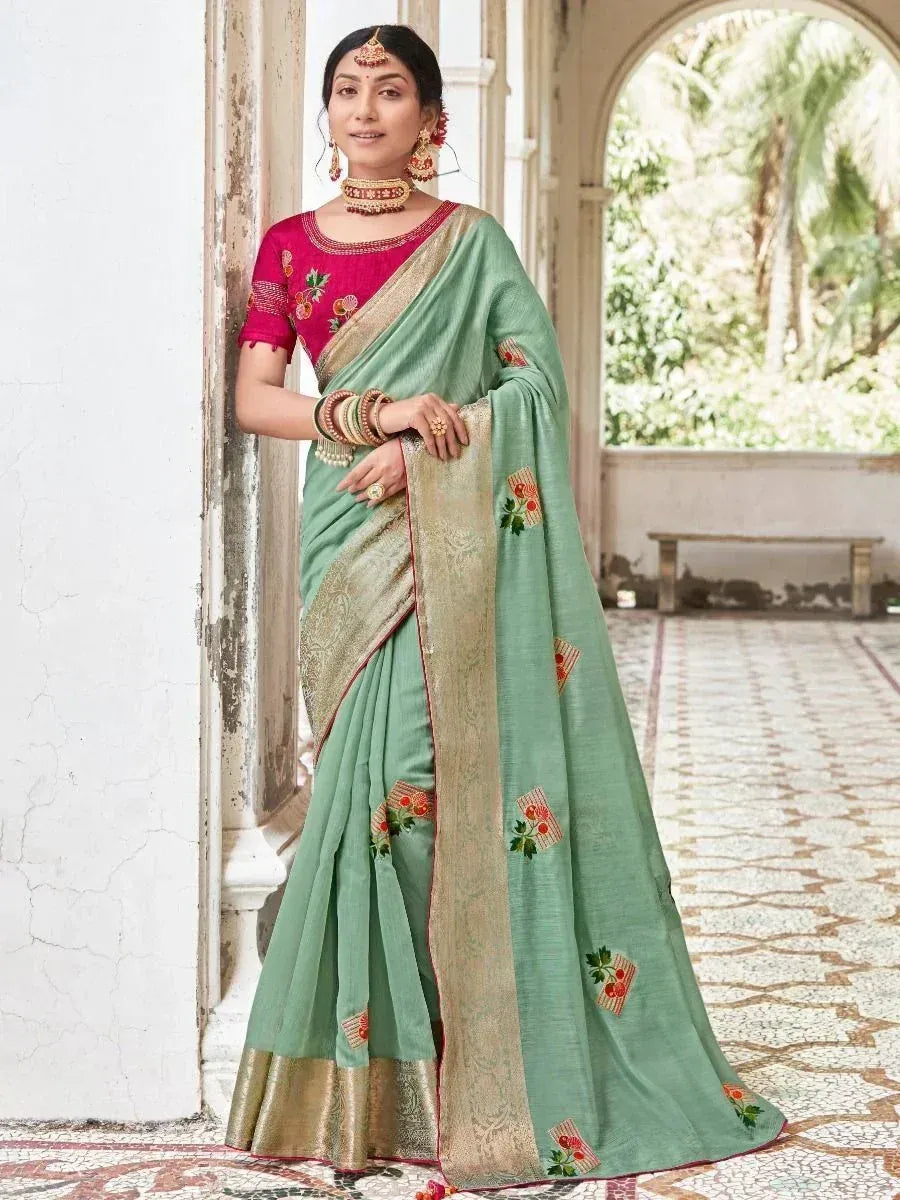 Mint green embroidered saree with gold border and pink blouse, traditional Indian ethnic wear