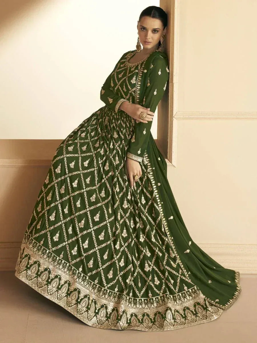 Elegant green designer anarkali with gold embroidery, perfect for Indian ethnic wear occasions.