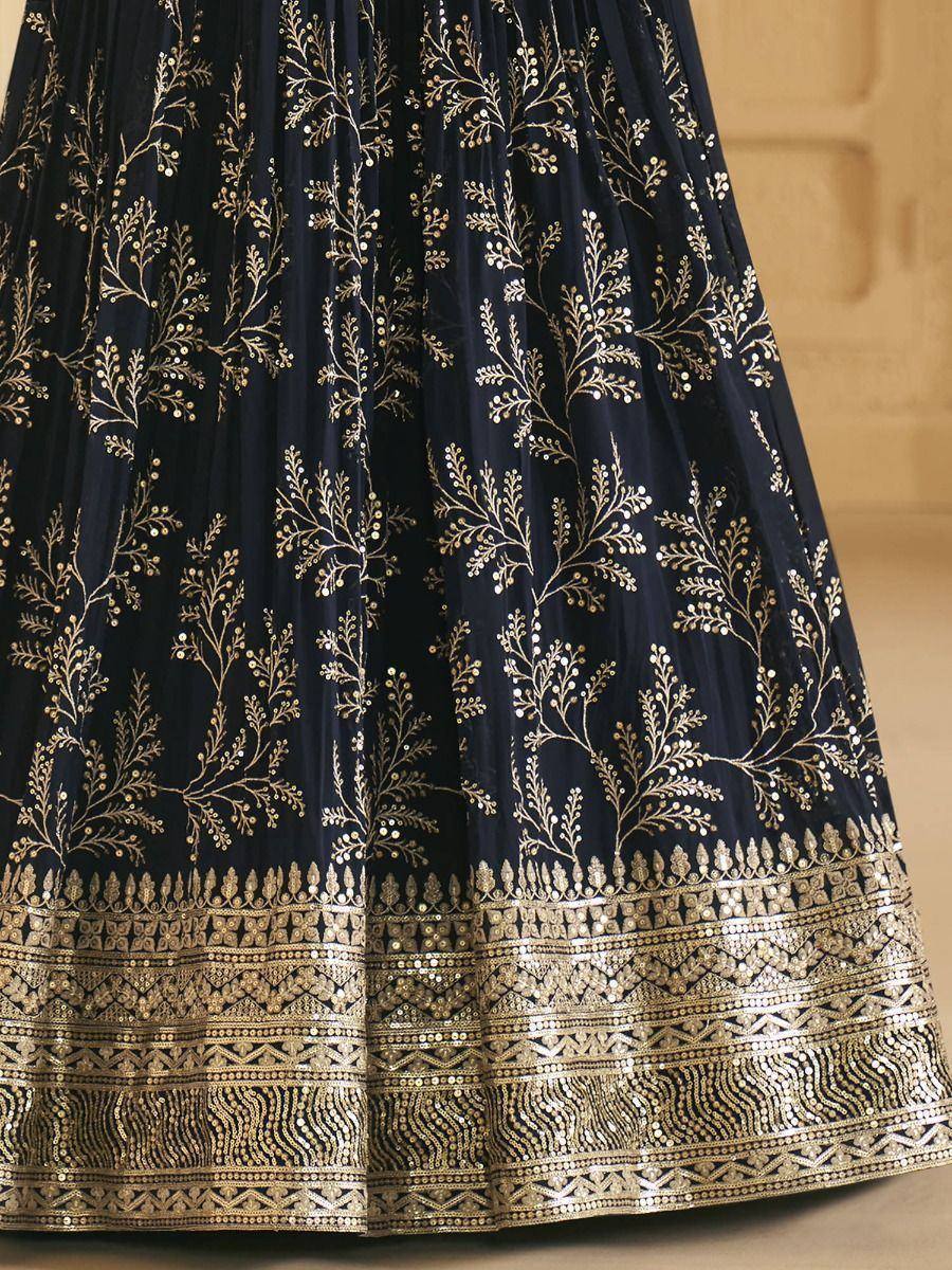 Navy blue lehenga with gold floral embroidery and intricate border detailing, perfect for Indian ethnic wear.