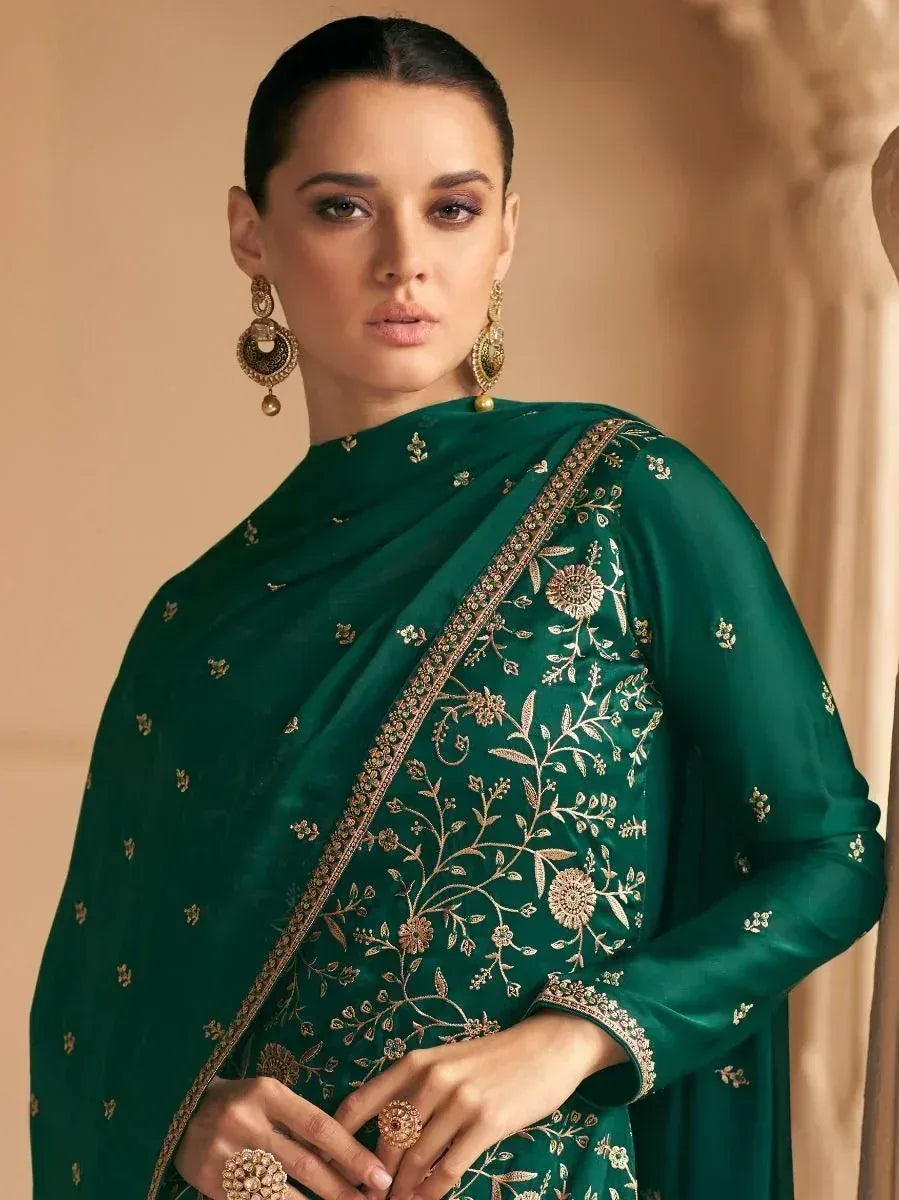 Emerald green embroidered saree with gold floral motifs, perfect for Indian ethnic occasions