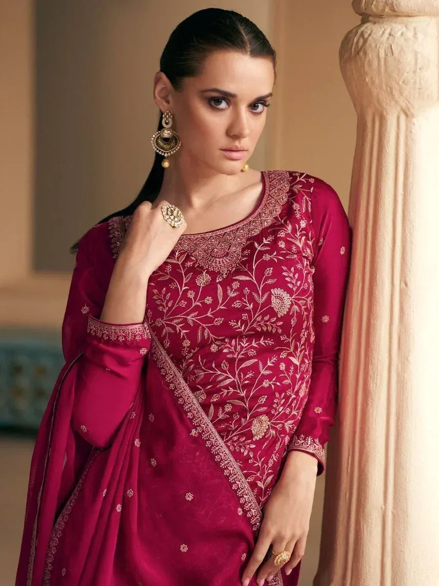 Elegant maroon salwar kameez with gold floral embroidery, perfect for Indian ethnic wear occasions.